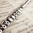 depositphotos_23093618-stock-photo-silver-flute-on-an-ancient